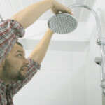 Man Replacing a Showerhead