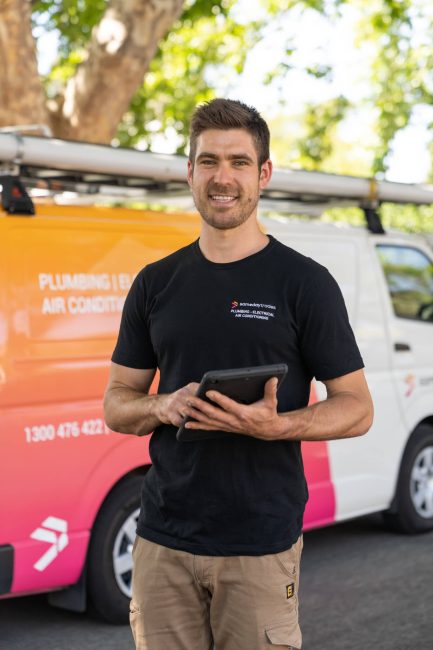 Same Day Trades technician with branded van